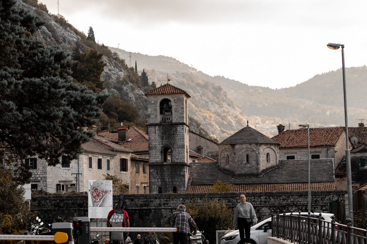 Wet stone lanes inside Budva Old Town on a rainy afternoon