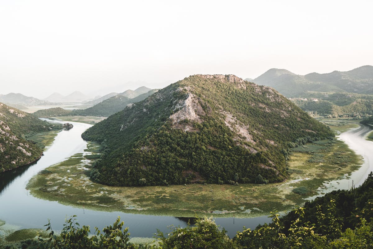 Skadar Lake at sunrise with mountains in the background