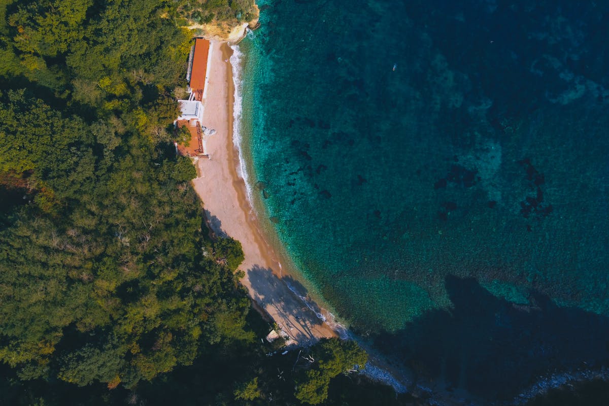 Petrovac beach with the Castello fortress on its rocky outcrop
